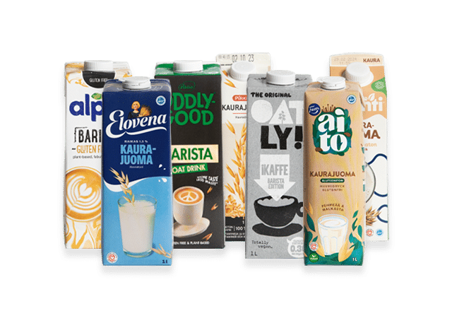 Usean eri tuotemerkin kaurajuomapurkkeja.